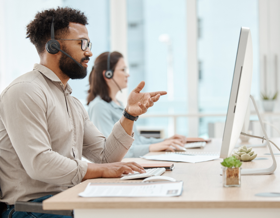 Professional and managed services team members developing customized applications to fill gaps in a customer’s contact centre.