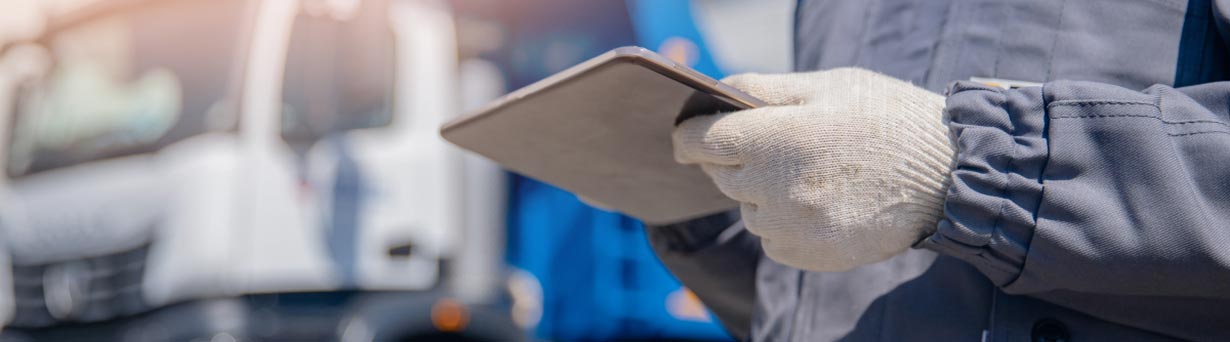 Worker assessing and improving operational efficiencies for waste and collection bin management.