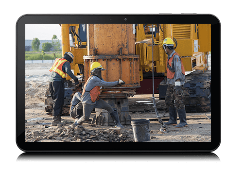 Workers performing maintenance on equipment after receiving alerts from Bell's asset tracking solution.